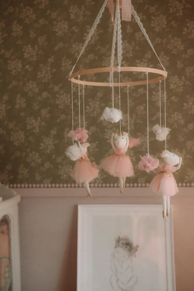 Hanging Mice Ballerina Felt Carousel Decoration, a hanging mice carousel decoration suspended in a child's decorated bedroom. 