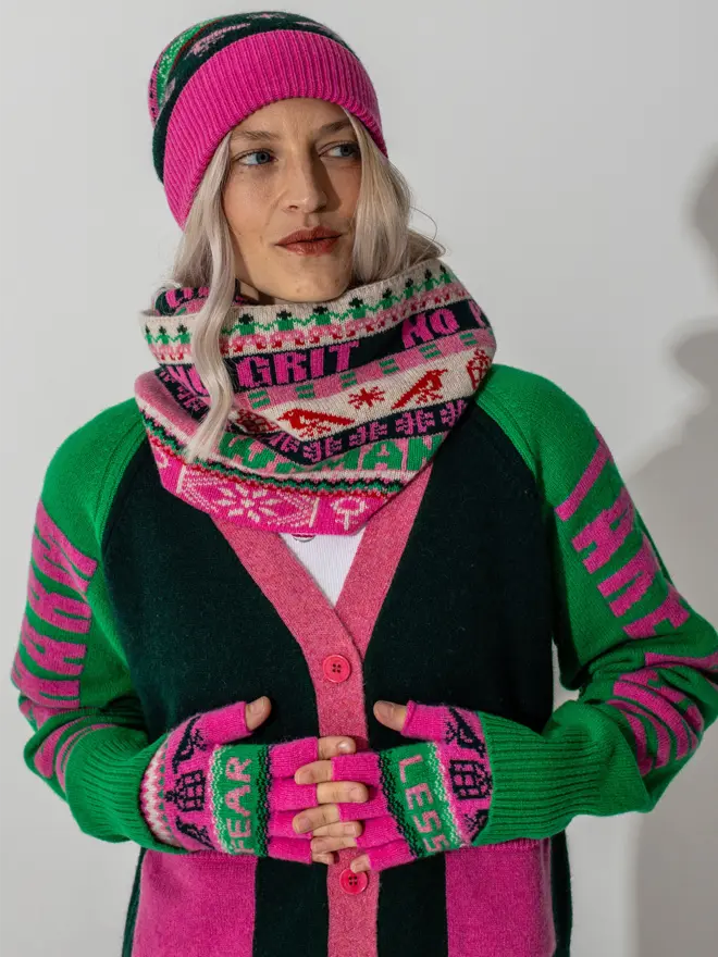 Model is wearing the fairisle loop scarf and beanie in bubblegum with our Do No Harm cardigan and fearless mittens in bubblegum and kelly green 