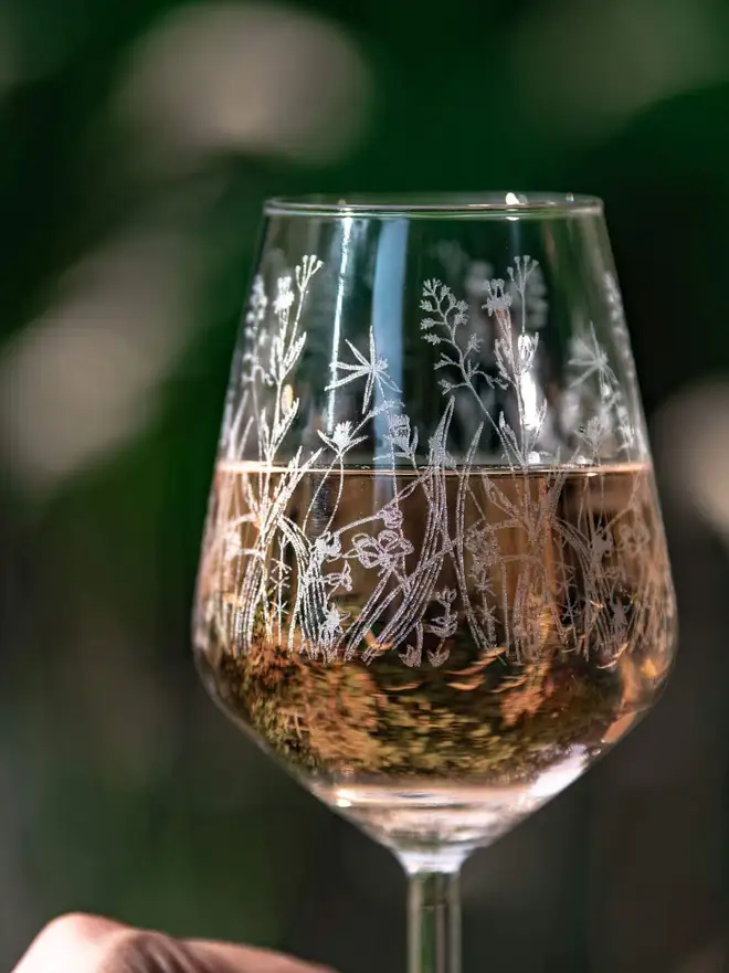Meadow Wine Glass, an etched wine glass with a wildflower pattern. 