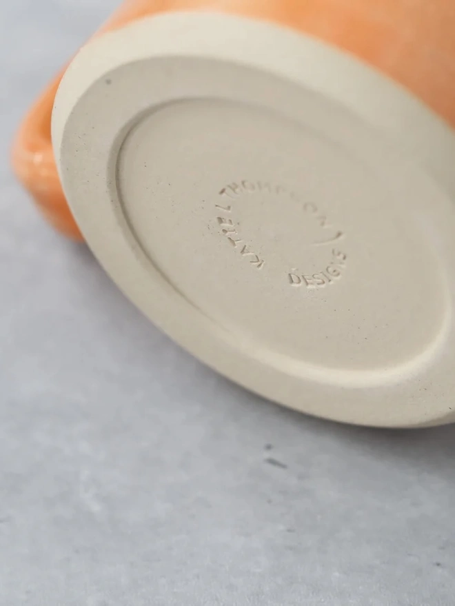 Ceramic Pint Mug, a colourful ceramic mug sitting on a white surface against a plain backdrop. 
