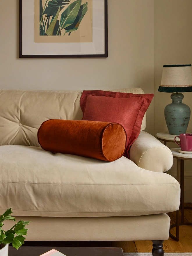Kika Bespoke handmade velvet piped bolster cushion 50x20cm in Rust