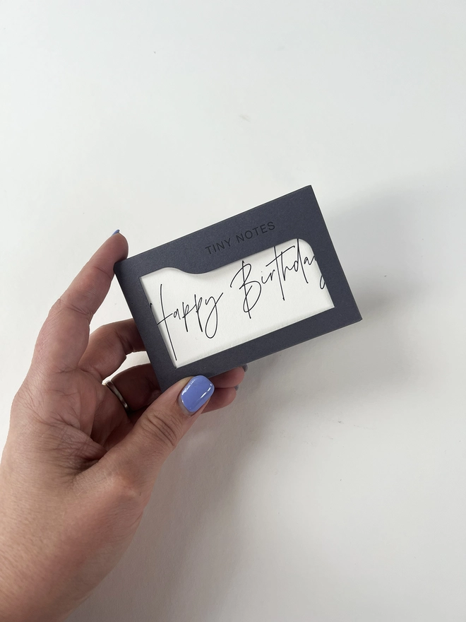 Letterpress happy birthday notes in their letterpress box. Happy birthday is written in a modern calligraphy style.