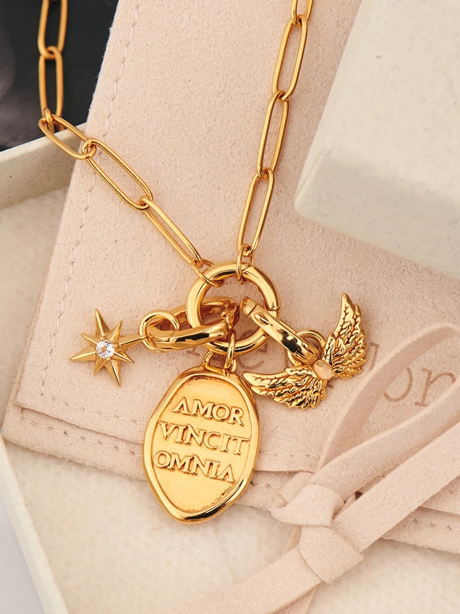 gold necklace with pendants and charms