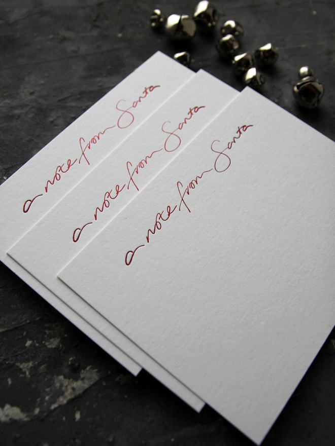 Notecards hand foiled in red says A Note From Santa with an envelope that says North Pole Mail