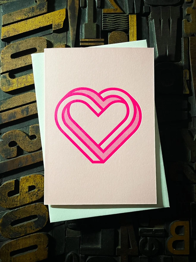 Valentine! A beautiful infinity heart monogram letterpress card printed with rich fluorescent pink ink on thick Candy Pink card with a luxury matching envelope; ideal to send a to a friend or loved one.