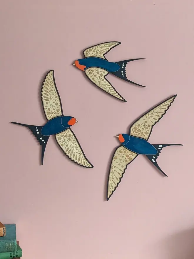 Flying Wooden Barn Swallows Hanging Wall Decor (Set Of 3), wooden barn swallow flying in a group hung on a wall. 