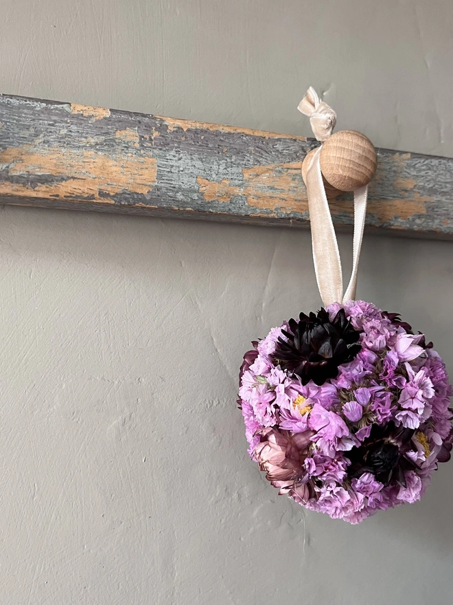 Berry Dried Flower Bauble made using a selection of pink and purple dried flowers. 