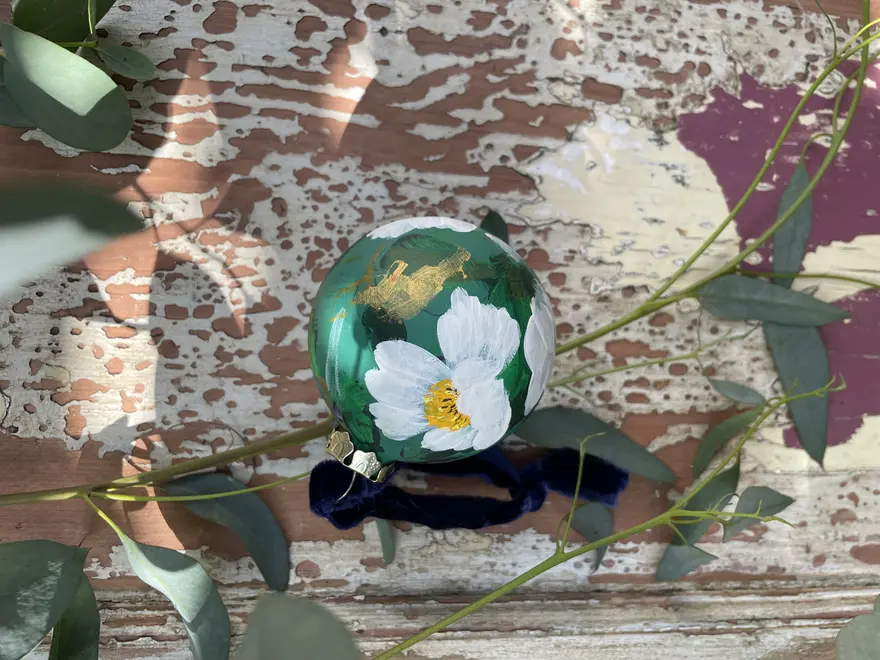 hand painted tree poppy christmas bauble ornament tree hanging rich green background gold flecks 