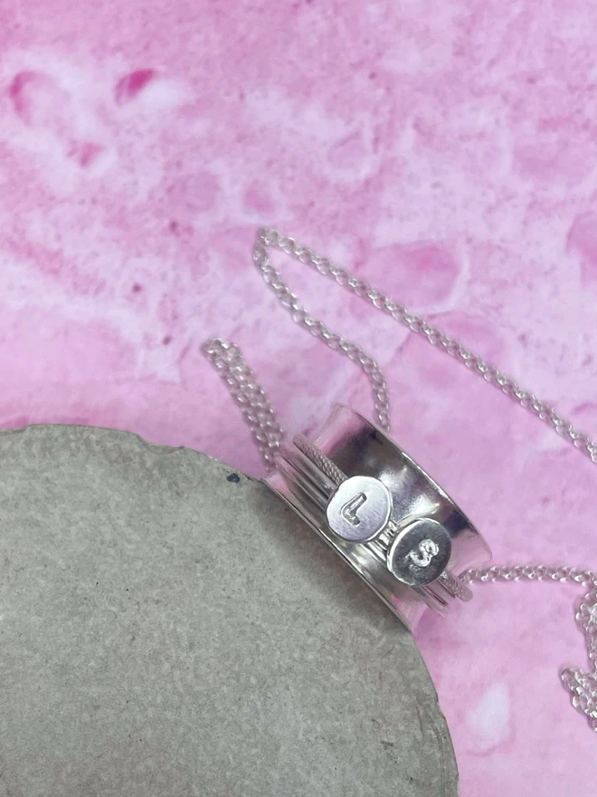 The 'It's Just A Phase' Spinner Pendant Necklace, gives you the reminder you need when the going gets tough. Parenting can be hard and this adult fidget spinner to give you something tactile to do with your hands to while away the stress. This piece of jewellery is hand made from recycled sterling silver. Made by Celina C Jewellery, a small business in the UK, find on Holly & Co.