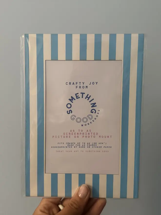 Thin Striped Screen Printed A6 / A5 / A4 Photo Mount. blue mount shown against gery background. 