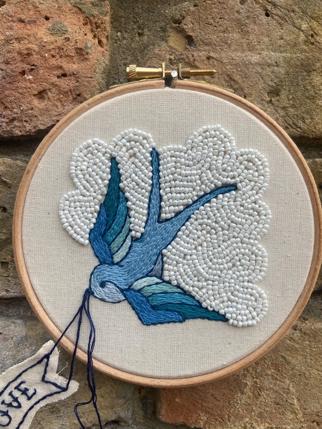 Embroidered blue swallow