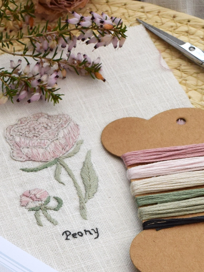 The Peony embroidery, with corresponding thread card.