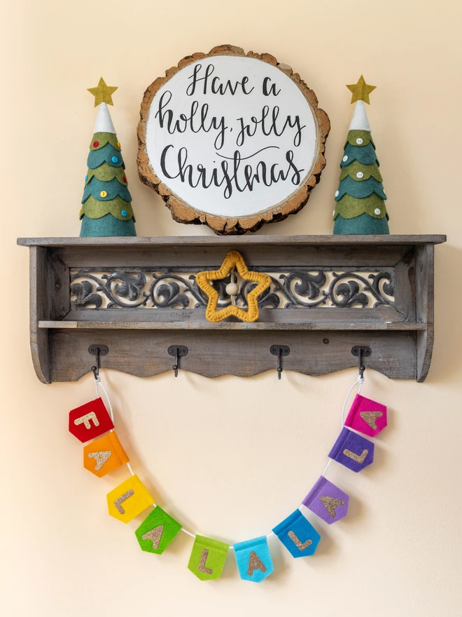 Rainbow Christmas bunting that reads 'FALALALALA'