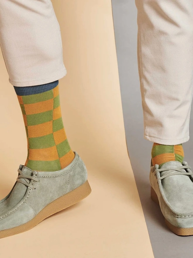 Men's Battenburg Check Organic Cotten Ankle Socks, a man wearing a pair of colourful socks. 