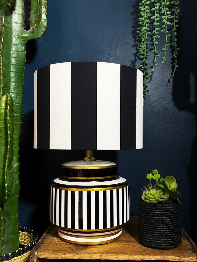 Beetlejuice black and white striped lampshade styled on a table lamp