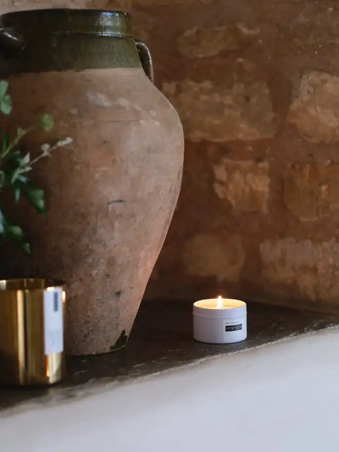Small travel container candle