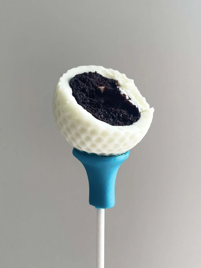 Golf Ball Cake Pops (Pack of 6, 12, 18, 24) a cross section of a golf ball cake pop showing indulgent chocolate filling