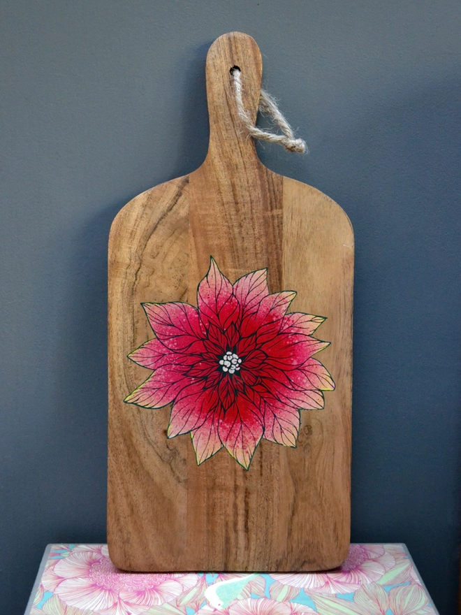 Handpainted serving board with a poinsettia design