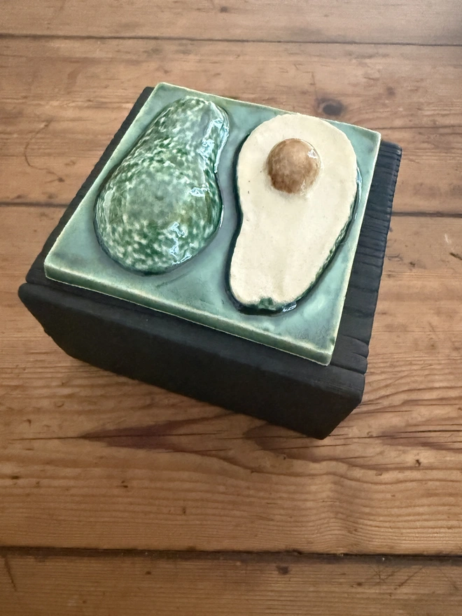 Charred black oak pot with avocado tile