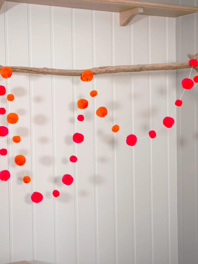 pom pom garland festival orange and pink 
