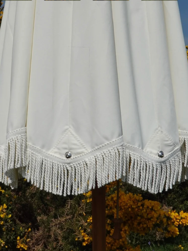 Double Cream Lampshade Parasol. A white parasol.
