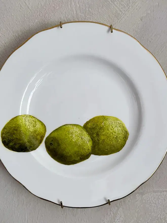 Fine Art Oil Painting Three Limes On A Vintage Plate, against a grey wall
