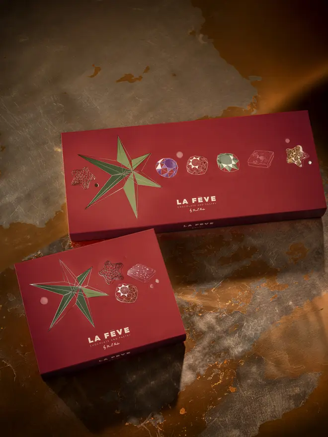 Dark red chocolate box packaging with festive graphics