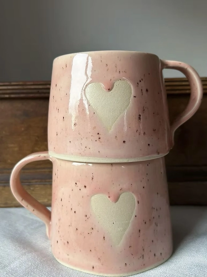 Heart Mug Strawberry Pink, stacked on top of each other in front of a white background. 