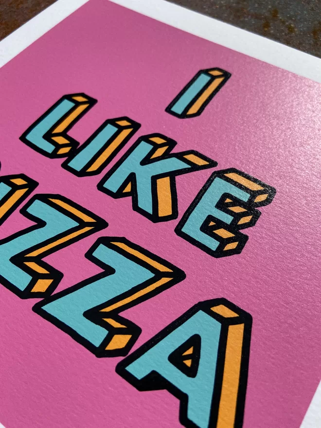 "I like Pizza" Mini Hand Pulled Screen Print square with pink background and the words i like pizza hand drawn and printed on top with black outline to the letters 