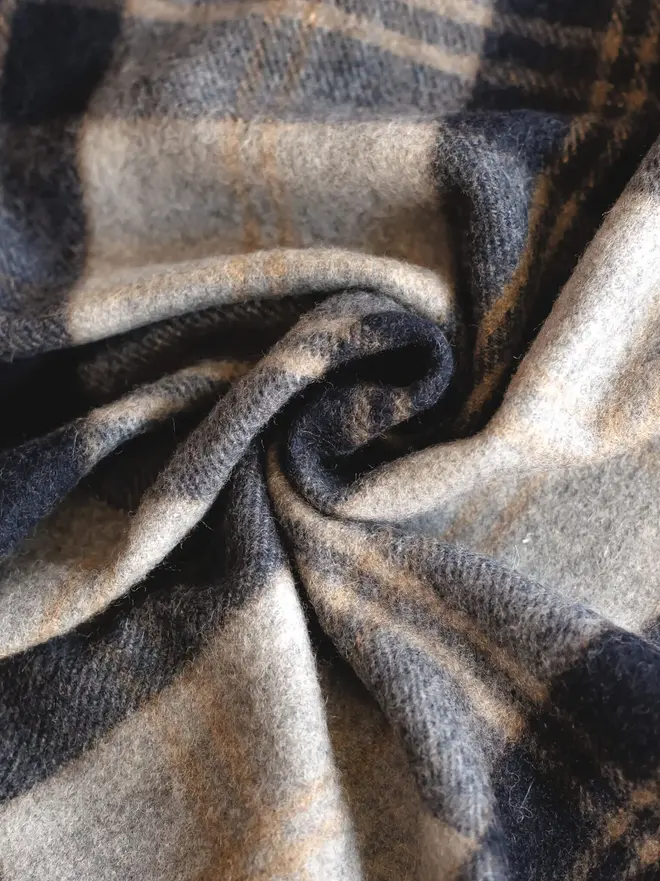 Bannockbane Silver, a curled up grey blanket. 