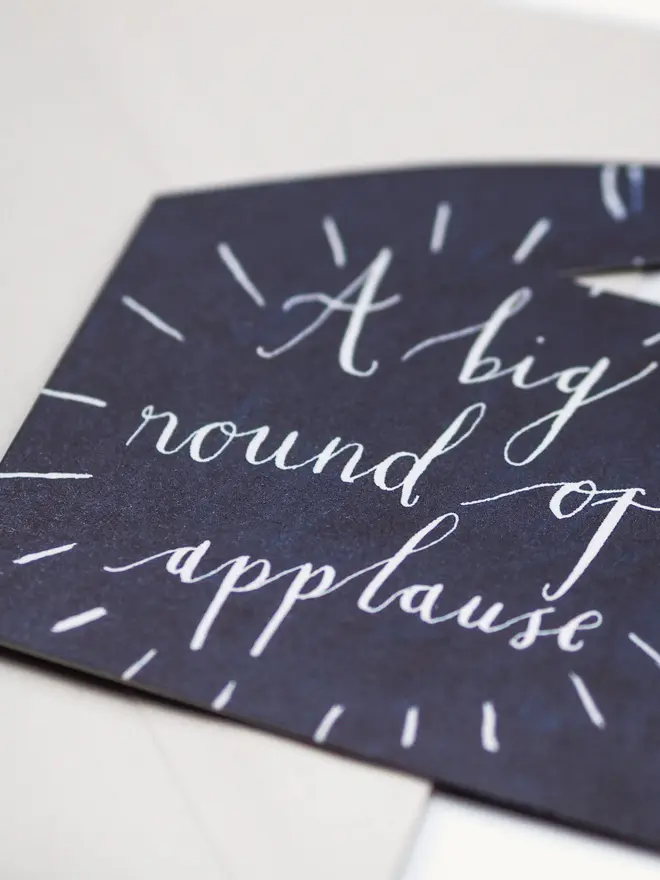 navy hand shape card with round of applause text