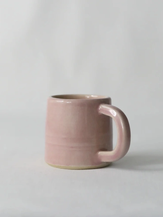 Classic Ceramic Espresso Mug, a colourful ceramic espresso mug sitting on a plain surface against a white backdrop. 
