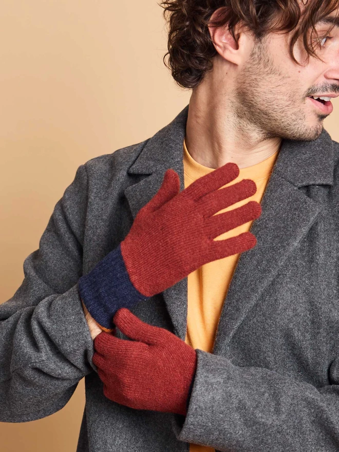 A Man Wearing Colourful Wool Gloves