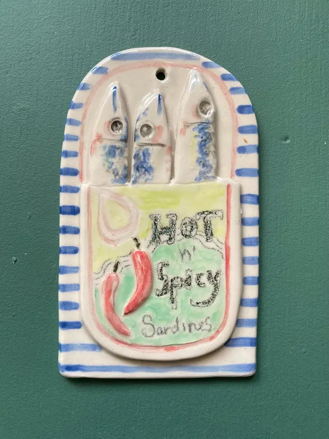 spicy sardine ceramic wall hanging