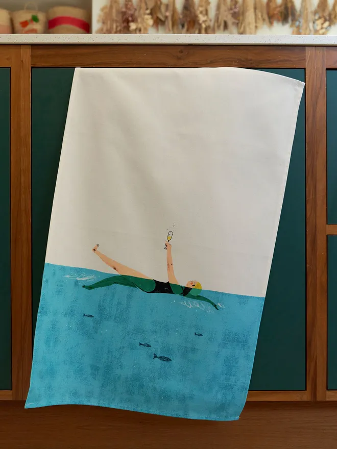 Swim and fizz tea towel