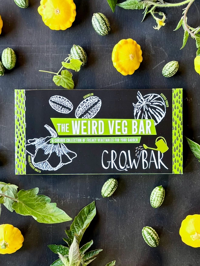 The Kids' weird Veg Bar on a black background surrounded by cucamelons and pattypan squash