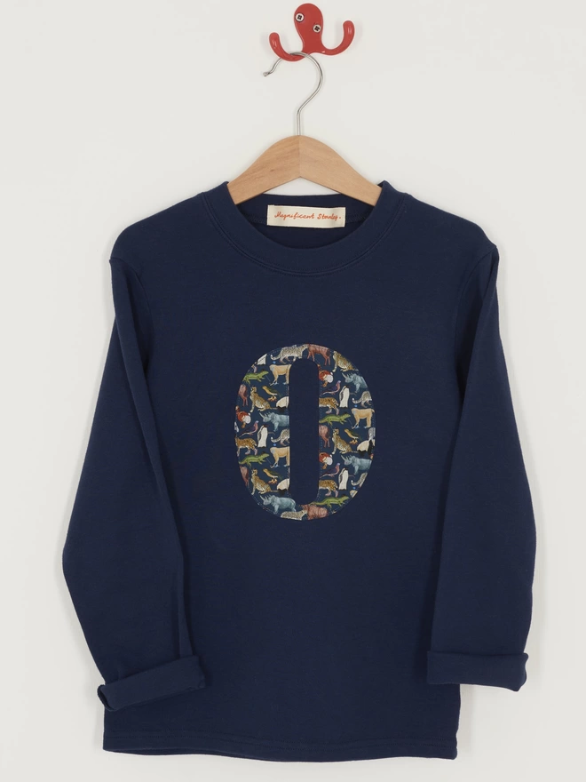 navy long sleeve tee with initial on in Quey 2 Liberty print