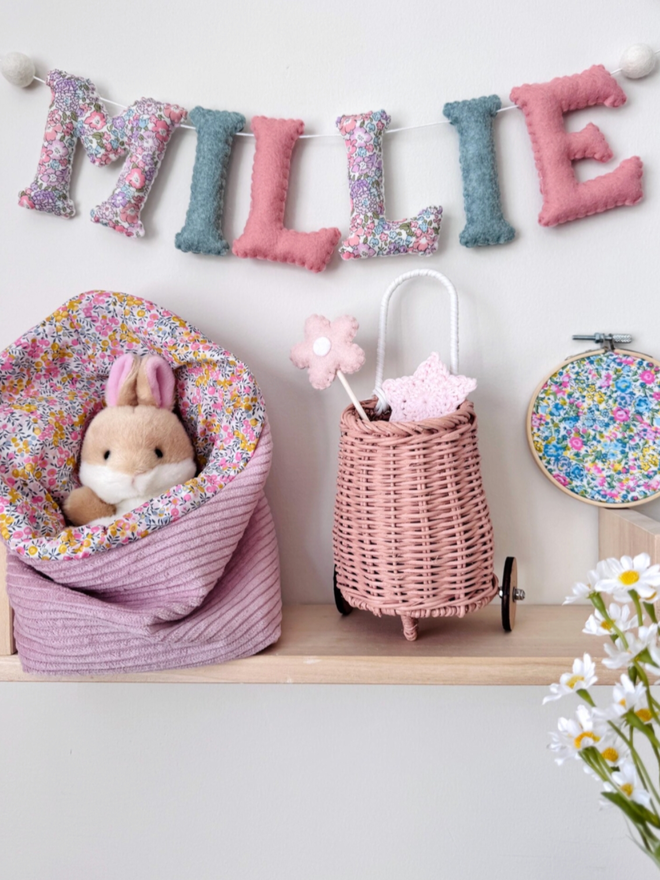 Liberty Floral Garland. A garland in pinks, purples and blues, with floral fabric.