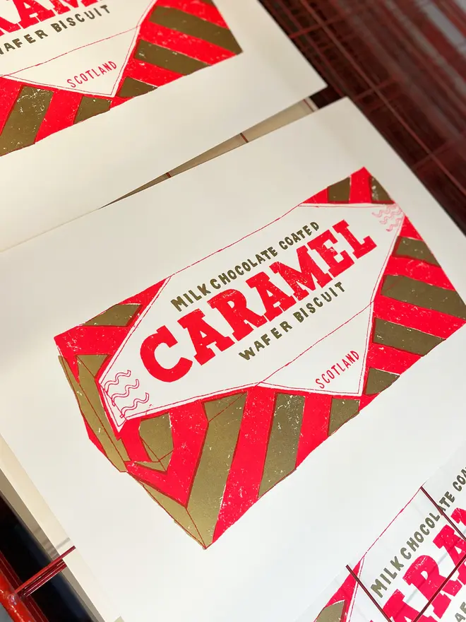 Tunnocks Caramel Biscuit Screenprint Quite Big Caramell, a colourful caramel biscuit screenprint on a studio rack. 