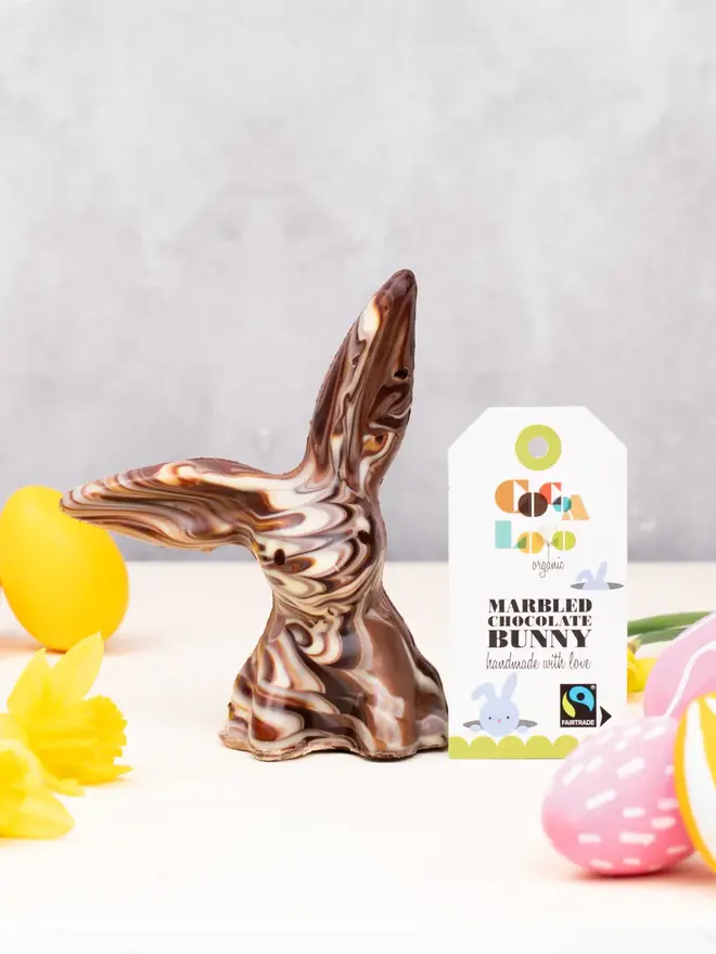 Solid Marbled Chocolate Bunny on a table with easter eggs