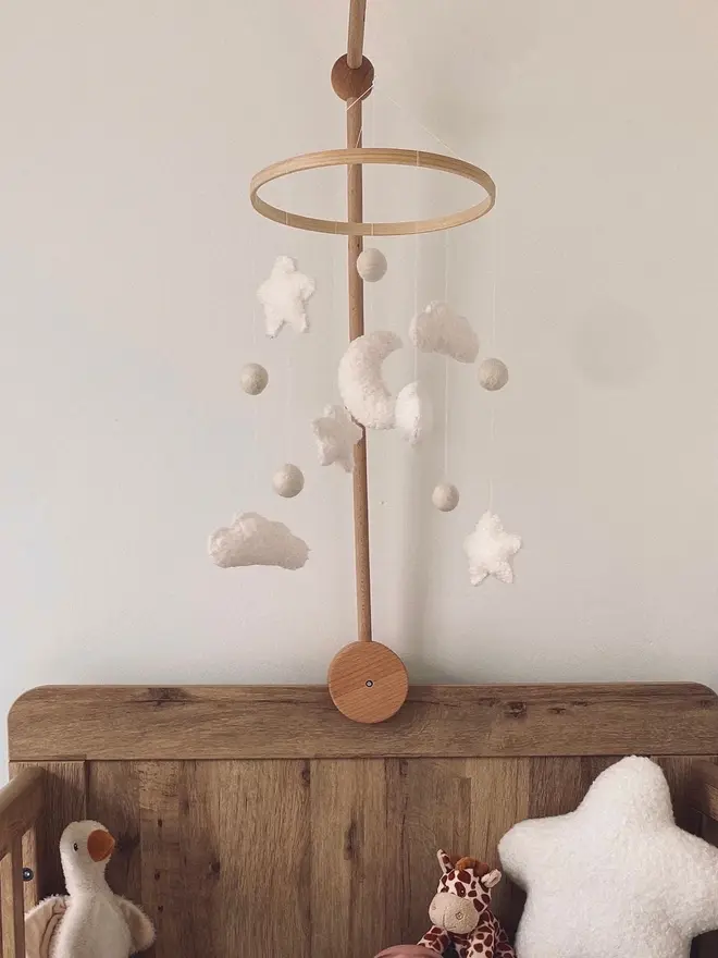 'sweet dreams' boucle baby mobile. a baby mobile hanging above a cot with moons, stars and clouds.