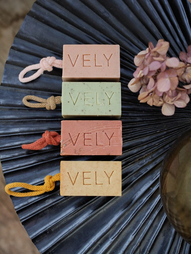 the vely soapery soap on a rope selection on a blue tray