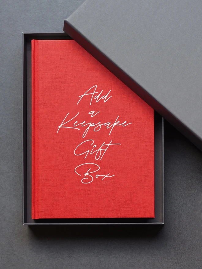 Add a grey sturdy gift box. Pictured with a red linen embossed journal inside. 