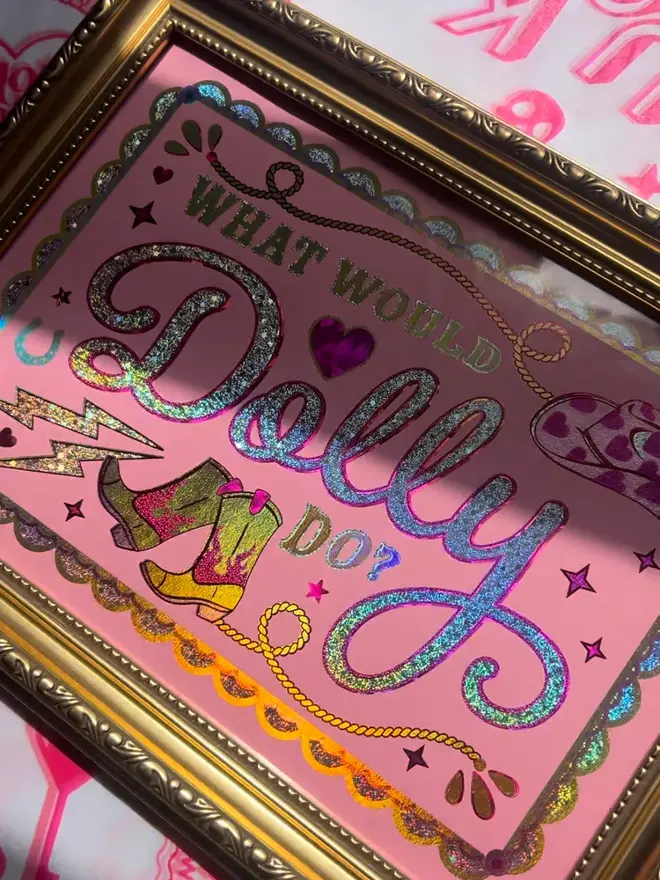 'What Would Dolly Do?' ScreenPrint, a colourful screenprint that says 'what would Dolly do?' sitting on a decorated surface. 