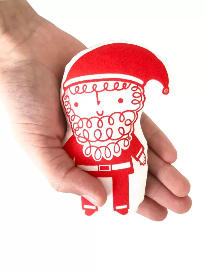 Mini Father Christmas Toy held in a hand