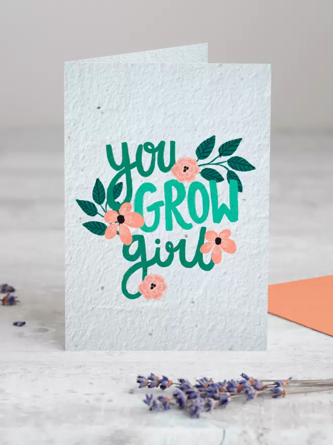 Seeded Paper Greeting Card featuring floral illustrations and ‘You Grow Girl’ in the centre with a sprig of Lavender placed in the foreground of the image
