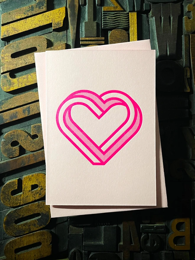 Valentine! A beautiful infinity heart monogram letterpress card printed with rich fluorescent pink ink on thick Candy Pink card with a luxury matching envelope; ideal to send a to a friend or loved one.