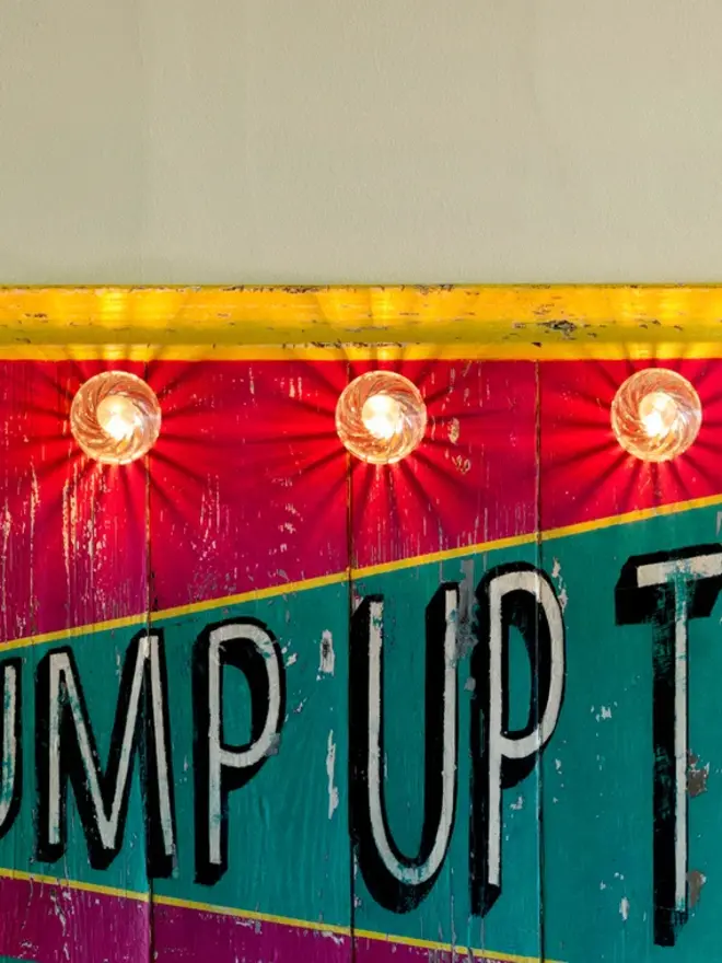 pump up the volume circus style sign