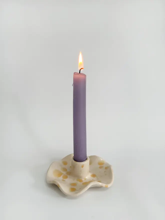 yellow ceramic wavy candlestick holder