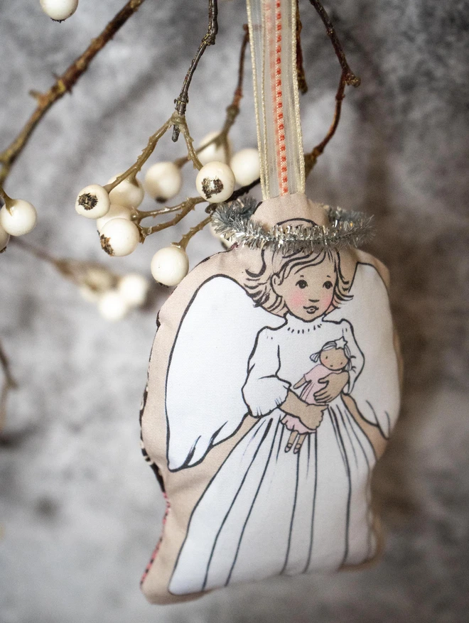 blonde sweet christmas tree angel holding a doll illustrated fabric christmas tree decoartaion